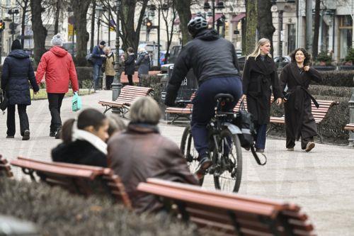 epa12833338 People cycle and walk in downtown Helsinki, Finland, 19 March 2026. According to the World Happiness Report 2026, covering 147 countries, Finland has been ranked as the happiest country in the world for the ninth consecutive year.  EPA/KIMMO BRANDT