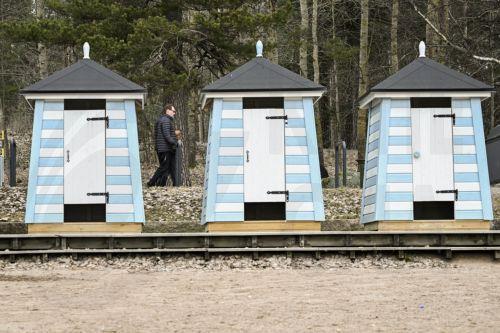 epa12833355 A person walks at an outdoor recreation area in Helsinki, Finland, 19 March 2026. According to the World Happiness Report 2026, covering 147 countries, Finland has been ranked as the happiest country in the world for the ninth consecutive year.  EPA/KIMMO BRANDT