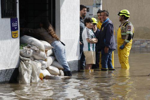 epa12834959 A man wades through a flooded street after heavy rains in Facatativa, Colombia, 19 March 2026. According to the mayor of Facatativa, Luis Carlos Casas, and local emergency agencies, heavy rains caused the Mancilla and San Rafael creeks to overflow and feed the Botello River, leading to severe flooding that affected more than 2,000 families. ...
