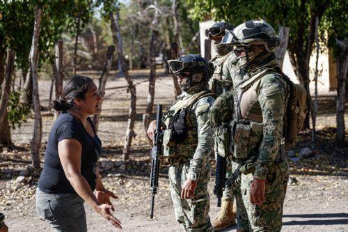 epa12835151 A person confronts members of the Mexican Army during an operation in the town of Valle Escondido, Sinaloa state, Mexico, 19 March 2026. Mexico’s Security Cabinet reported an operation in Sinaloa that left 11 suspected criminals dead and a daughter of El Mayo Zambada, the leader of the Sinaloa Cartel currently imprisoned in the United States,...