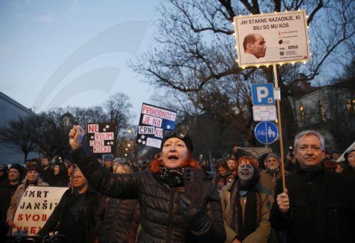 epa12837171 Slovenians protest outside the American Embassy against Janez Jansa and his Slovenian Democratic Party party (SDS) in downtown Ljubljana, Slovenia, 20 March 2026. The 22 March 2026 parliamentary election will take place as reports of an alleged covert operation by a private intelligence company to influence the vote have been made.  EPA/ANTONIO...