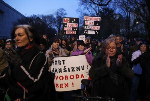epa12837172 Slovenians protest outside the American Embassy against Janez Jansa and his Slovenian Democratic Party party (SDS) in downtown Ljubljana, Slovenia, 20 March 2026. The 22 March 2026 parliamentary election will take place as reports of an alleged covert operation by a private intelligence company to influence the vote have been made.  EPA/ANTONIO...