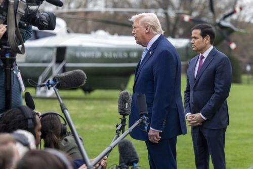 epa12837374 US President Donald J. Trump (C), with Secretary of State Marco Rubio (R), responds to a question from the news media as he walks to board Marine One on the South Lawn of the White House in Washington, DC, USA, 20 March 2026.  EPA/SHAWN THEW / POOL