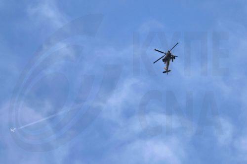 epa12841446 An Israeli military helicopter flies near the Israel-Lebanon border, 22 March 2026. Israel resumed operations in Lebanon in early March 2026, targeting Hezbollah's infrastructure and personnel.  EPA/ATEF SAFADI