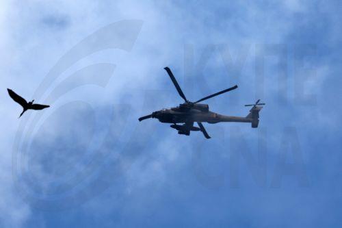 epa12841448 An Israeli military helicopter flies near the Israel-Lebanon border, 22 March 2026. Israel resumed operations in Lebanon in early March 2026, targeting Hezbollah's infrastructure and personnel.  EPA/ATEF SAFADI