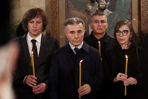 epa12841482 Founder of the Georgian Dream party Bidzina Ivanishvili (2-L), his wife Ekaterine Khvedelidze (R), and Georgia's Prime Minister Irakli Kobakhidze (L) attend the funeral service of the late Georgia's Orthodox Patriarch Ilia II at the Sioni Cathedral in Tbilisi, Georgia, 22 March 2026. Catholicos-Patriarch Ilia II (Irakli Gudushauri-Shiolashvili)...