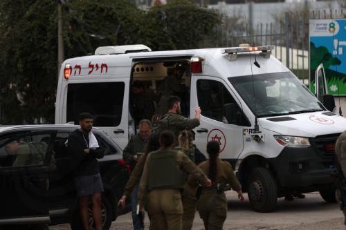 epa12843885 Israeli security, rescue, and paramedics at the scene of a direct hit by a missile fired by Hezbollah in the northern  Israeli city of Kiryat Shmona, 23 March 2026. The Israeli military stated it is conducting strikes across Lebanon targeting Hezbollah infrastructure and personnel.  EPA/ATEF SAFADI