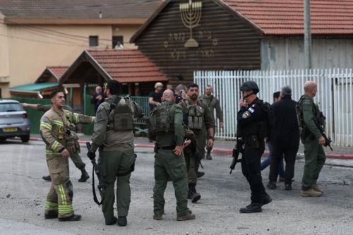 epa12843887 Israeli security, rescue, and paramedics at the scene of a direct hit by a missile fired by Hezbollah in the northern  Israeli city of Kiryat Shmona, 23 March 2026. The Israeli military stated it is conducting strikes across Lebanon targeting Hezbollah infrastructure and personnel.  EPA/ATEF SAFADI
