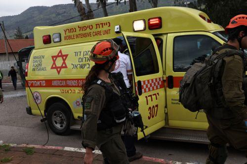 epa12843889 Israeli security, rescue, and paramedics at the scene of a direct hit by a missile fired by Hezbollah in the northern  Israeli city of Kiryat Shmona, 23 March 2026. The Israeli military stated it is conducting strikes across Lebanon targeting Hezbollah infrastructure and personnel.  EPA/ATEF SAFADI
