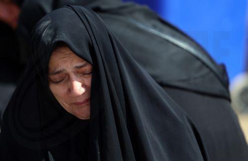 epa12850866 An Iranian woman mourns during the funeral for victims of the conflict between Iran, Israel and the US, at the Behesht Zahra cemetery in southern Tehran, Iran, 26 March 2026. A joint Israeli and US military operation continues to target multiple locations across Iran, since the early hours of 28 February 2026.  EPA/ABEDIN TAHERKENAREH