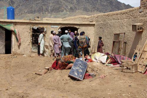 epa12851037 Residents inspect damaged belongings after heavy rains in Kandahar, Afghanistan, 26 March 2026. At least ten people died and  six others were injured, while dozens of homes were destroyed and thousands of acres of farmland were severely damaged due to heavy rains and flooding in Kandahar and Helmand, according to Afghan officials. ...