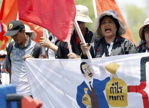 epa12865765 Protesters shout slogans during a demonstration against the soaring fuel prices and living costs, outside Government House, in Bangkok, Thailand, 02 April 2026. Labor networks and civil society groups staged the protest against oil price hikes, urging the government to address the energy crisis and its direct impact on the cost of living. ...