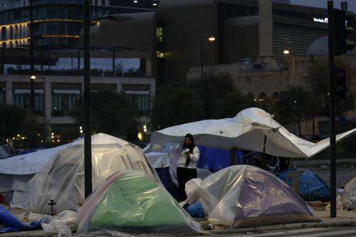 epa12866494 An internally displaced woman stands outside her tent at a makeshift camp in the waterfront area of Beirut, Lebanon, 02 April 2026. According to the UN, more than 1.1 million people have been displaced across the country following Israeli airstrikes on southern Lebanon, Beirut's southern suburbs, and the Bekaa Valley. The Lebanese Ministry of...