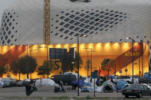 epa12866495 A person rides a motorcycle past tents of internally displaced people at a makeshift camp in the waterfront area of Beirut, Lebanon, 02 April 2026. According to the UN, more than 1.1 million people have been displaced across the country following Israeli airstrikes on southern Lebanon, Beirut's southern suburbs, and the Bekaa Valley. The...