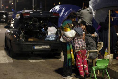 epa12866509 A family packs their belongings before returning to devastated areas of the southern suburb of Beirut, Lebanon, 02 April 2026. Adverse weather, heavy rain, and a shortage of tents forced some residents to return to their homes despite Israeli warnings and ongoing airstrikes. According to the UN, more than 1.1 million people have been displaced...