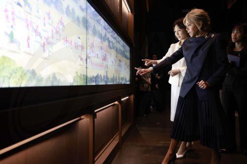 epa12866792 Kim Hea Kyung (rear), wife of South Korean President Lee Jae Myung, and Brigitte Macron (front), wife of French President Emmanuel Macron, view a collection of royal documents known as 'Uigwe,' which records and illustrates royal protocols during the 1392-1910 Joseon Dynasty, as they tour the National Museum of Korea in Seoul, South Korea, 03...
