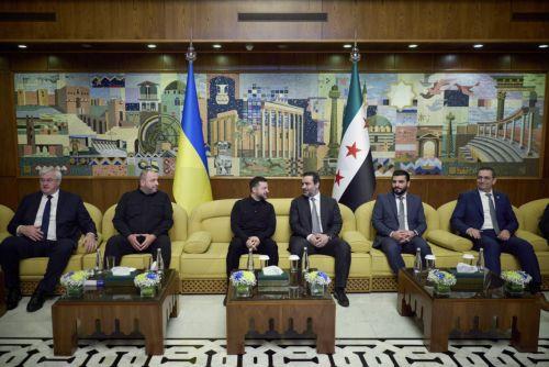 epa12870951 A handout photo made available by Presidential Press Service shows Ukrainian President Volodymyr Zelensky (C-L) and Syrian Foreign Minister of the caretaker government Asaad Hassan al-Shibani (C-R) during their meeting in Damascus, Syria, 05 April 2026. Zelensky arrived in Syria for his first official visit to meet with top Syrian officials amid...