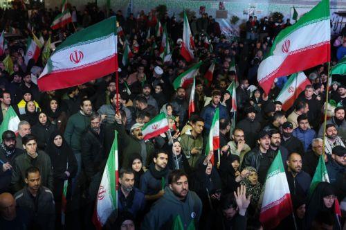 epa12874350 Iranians wave flags during a demonstration following the announcement of a two-week ceasefire at Enghelab Square in Tehran, Iran, 08 April 2026. Iran and the USA agreed to the two-week truce to halt military operations and keep the Strait of Hormuz open for oil and gas shipments, with formal peace talks set to begin in Islamabad on 10 April. ...