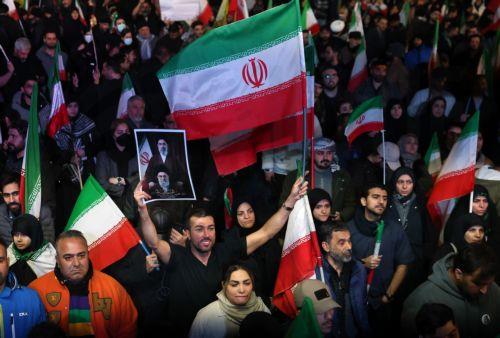 epa12874353 Iranians wave flags during a demonstration following the announcement of a two-week ceasefire at Enghelab Square in Tehran, Iran, 08 April 2026. Iran and the USA agreed to the two-week truce to halt military operations and keep the Strait of Hormuz open for oil and gas shipments, with formal peace talks set to begin in Islamabad on 10 April. ...