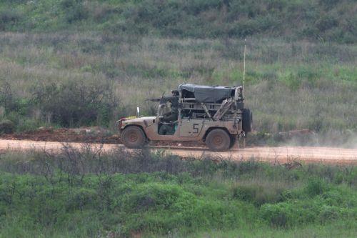 epa12877165 An Israeli military vehicle passes on the Lebanese side of the border, as seen from the upper Galilee on the Israel-Lebanon border, 09 April 2026. The Israeli military said it continued targeting operations of Hezbollah in southern Lebanon.  EPA/ATEF SAFADI