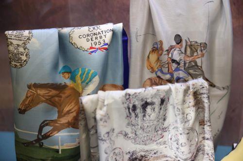 epa12877228 Scarves worn by Britain’s Queen Elizabeth II are displayed at the exhibition 'Queen Elizabeth II: Her Life in Style' at The King’s Gallery, Buckingham Palace in London, Britain, 09 April 2026. The exhibition features 300 pieces of clothing and accessories worn by late Britain’s Queen Elizabeth and runs from 10 April to 18 October 2026.  EPA/NEIL...