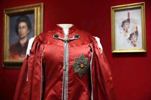 epa12877255 A ceremonial tunic of Britain’s Queen Elizabeth II is displayed at the exhibition 'Queen Elizabeth II: Her Life in Style' at The King’s Gallery, Buckingham Palace in London, Britain, 09 April 2026. The exhibition features 300 pieces of clothing and accessories worn by late Britain’s Queen Elizabeth and runs from 10 April to 18 October 2026. ...