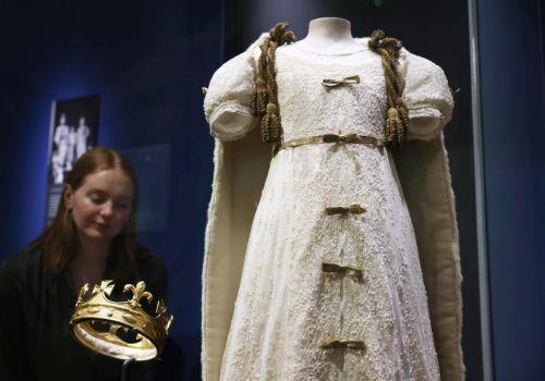 epa12877281 A christening robe worn by Britain’s Queen Elizabeth II is displayed at the exhibition 'Queen Elizabeth II: Her Life in Style' at The King’s Gallery, Buckingham Palace in London, Britain, 09 April 2026. The exhibition features 300 pieces of clothing and accessories worn by late Britain’s Queen Elizabeth and runs from 10 April to 18 October 2026....