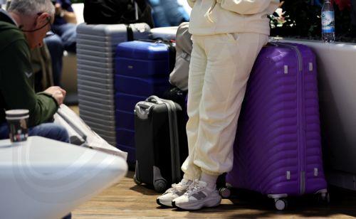 epa12879835 Luggage of waiting passengers in Terminal 1 during a strike at the international airport at Frankfurt Airport, in Frankfurt am Main, Germany, 10 April 2026. The UFO cabin crew union has called on its members to strike, to press their demands for better wages.  EPA/RONALD WITTEK