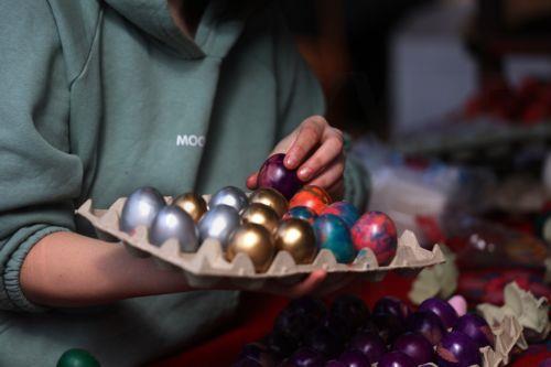 epa12880092 A vendor packs hand-painted Easter eggs for sale at a farmers market in Belgrade, Serbia, 10 April 2026. Orthodox Serbs will celebrate Easter on 12 April 2026.  EPA/ANDREJ CUKIC