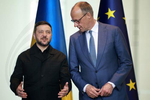epa12888765 German Chancellor Friedrich Merz (R) and Ukrainian President Volodymyr Zelensky (L) attend a press conference at the Chancellery in Berlin, Germany, 14 April 2026. Following the Hungarian elections on 12 April, the German government expects that the EU’s 90 billion euro loan package for Ukraine will be unblocked swiftly.  EPA/CLEMENS BILAN