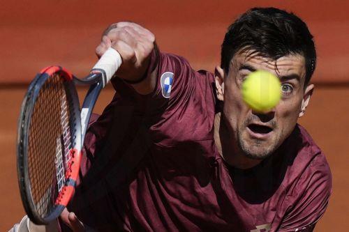 epa12888840 Sebastian Ofner of Austria serves against Alex de Minaur of Australia during the second day of the ATP 500 Barcelona Open tennis tournament in Barcelona, Spain, 14 April 2026.  EPA/ENRIC FONTCUBERTA