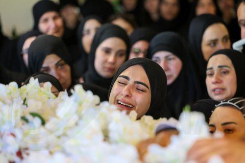 epa12909564 People mourn as they gather around the coffin of Lebanese journalist Amal Khalil during her funeral procession in the village of Baisariyah, southern Lebanon, 23 April 2026. Al-Akhbar newspaper journalist Amal Khalil was killed on 22 April after an Israeli airstrike targeted a building in the village of al-Tiri, Bint Jbeil district, in southern...