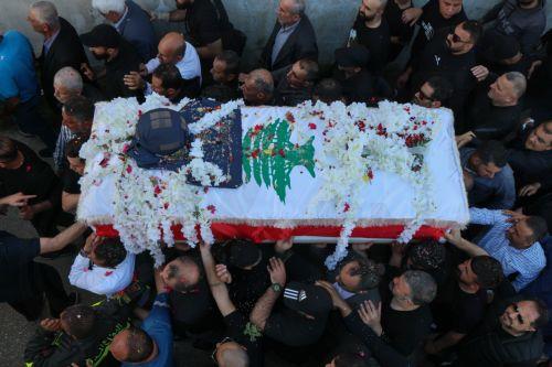 epaselect epa12909551 People carry the coffin of Lebanese journalist Amal Khalil during her funeral procession in the village of Baisariyah, southern Lebanon, 23 April 2026. Al-Akhbar newspaper journalist Amal Khalil was killed on 22 April after an Israeli airstrike targeted a building in the village of al-Tiri, Bint Jbeil district, in southern Lebanon. ...
