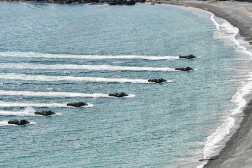 epa12916203 A handout photo made available by the South Korean Marine Corps Command shows KAAV amphibious assault vehicles carrying Marines moving toward a beach in Pohang, about 270 kilometers southeast of Seoul, South Korea, 26 April 2026 (issued 27 April 2026). The Navy and Marine Corps launched a weeklong regular amphibious landing exercise to maintain...