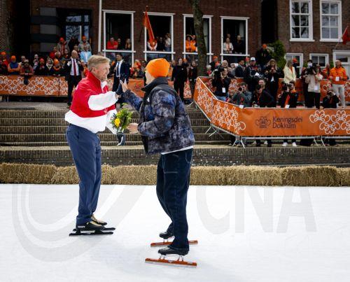 epa12917060 King Willem-Alexander of the Netherlands (L) and Jens van 't Wout skate on ice during the celebration of King's Day, in Dokkum, the Netherlands, 27 April 2026. The national holiday of 'Koningsdag' (King's Day) marks the birthday of the Dutch monarch.  EPA/SEM VAN DER WAL / POOL