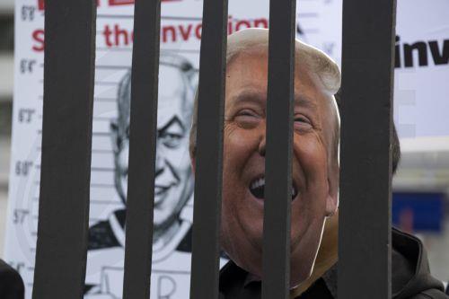 epa12920811 South Korean protesters wearing masks of U.S. President Donald Trump (R) hold a mugshot of Israeli Prime Minister Benjamin Netanyahu (L) as they perform during a demonstration against U.S. and Israeli military actions in Iran outside the U.S. embassy in Seoul, South Korea, 29 April 2026.  EPA/JEON HEON-KYUN