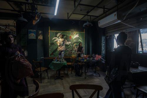 epa12922462 Palestinian Joud Mohammed (R), 18, and Rahaf Al-Halabi (L), 18, paint together inside a small cafe in Gaza City, 29 April 2026. The two teenagers use their artwork as a means of self-expression and to provide financial support for their families amid ongoing economic hardship. With Gaza's educational system largely paralyzed since the outbreak...
