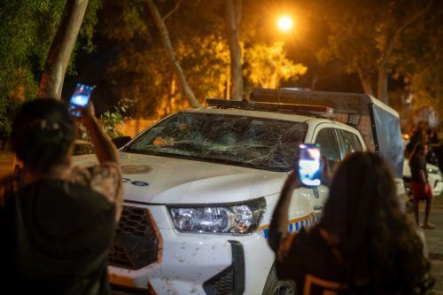 epa12925505 A damaged police vehicle sits outside Alice Springs Hospital following community unrest in Alice Springs, Australia, 30 April 2026 (issued 01 May 2026). The unrest erupted following the arrest of a man accused in connection with the abduction and murder of five-year-old Kumanjayi Little Baby.  EPA/RHETT HAMMERTON  AUSTRALIA AND NEW ZEALAND OUT