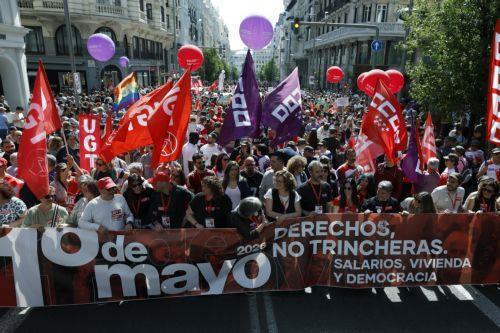 epa12926134 People take part in a rally to mark International Workers' Day in Madrid, Spain, 01 May 2026.  EPA/J.J.Guillen