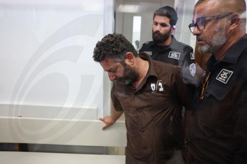 epa12929422 Saif Abu Keshek (C), a member of the Global Sumud Flotilla, arrives to attend his trial for a remand extension at the Ashkelon Magistrate's Court in Ashkelon, Israel, 03 May 2026. Abu Keshek along with Thiago Avila were arrested on 02 May off the island of Crete, according to the organization. According to the Israeli Ministry of Foreign...