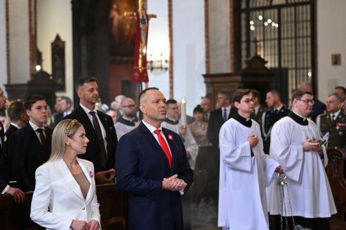 epa12929427 Polish President Karol Nawrocki (2L) and First Lady Marta Nawrocka (L) attend a Holy Mass for the Homeland as part of 3rd May Constitution Day celebrations at the Archcathedral of St. John the Baptist in Warsaw, Poland, 03 May 2026The 03 May National Holiday commemorates the adoption of the 03 May Constitution in 1791. This document was the...