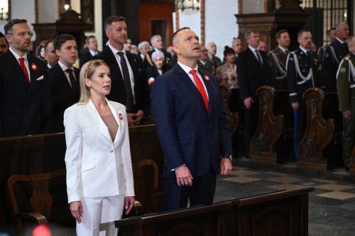 epa12929429 Polish President Karol Nawrocki (R) and First Lady Marta Nawrocka (L) attend a Holy Mass for the Homeland as part of 3rd May Constitution Day celebrations at the Archcathedral of St. John the Baptist in Warsaw, Poland, 03 May 2026The 03 May National Holiday commemorates the adoption of the 03 May Constitution in 1791. This document was the...