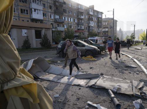 epa12934995 A handout photo made available by the press service of the 93rd Kholodnyi Yar Separate Mechanized Brigade of Ukrainian Armed Forces shows peole walking over debris in the aftermath of a Russian airstrike in Kramatorsk, Donetsk region, Ukraine, 05 May 2026, amid the ongoing Russian invasion. Several people died and a dozens were injured during...