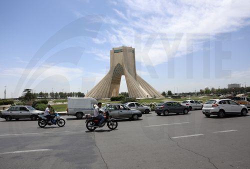 epa12938646 People drive around Azadi Tower in Tehran, Iran, 07 May 2026. US President Donald Trump announced a pause in the operation of escorting ships through the Strait of Hormuz, signaling progress in peace talks with Tehran.  EPA/ABEDIN TAHERKENAREH