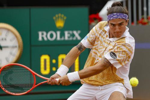 epa12947050 Mattia Bellucci of Italy in action during his men’s singles round of 32 match against Martin Landaluce of Spain at the Italian Open tennis tournament in Rome, Italy, 11 May 2026.  EPA/FABIO FRUSTACI