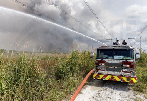 epa12947909 Firefighters battle a wildfire in the Everglades near Pembroke Pines, Florida, United States, 11 May 2026. Florida is facing an active wildfire season, with the Max Road Fire burning thousands of acres across parts of Broward and Miami-Dade counties and smoke affecting nearby communities.  EPA/CRISTOBAL HERRERA-ULASHKEVICH