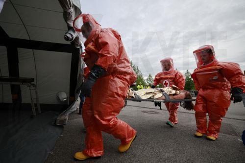 epa12947947 Members of the Bavarian Red Cross and a role player participate in an exercise demonstrating the organization’s complex emergency response system in Munich, Germany, 11 May 2026. The drill involved more than 75 emergency responders and role players and simulated a mass casualty incident caused by a crowd accident and the leak of an initially...