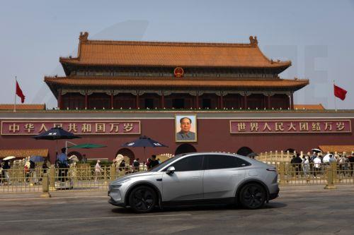 epa12952164 A car drives past Tiananmen Square in Beijing, China, 13 May 2026. US President Donald Trump is due to arrive in Beijing for a high-stakes state visit running through 15 May, marking his first return to the mainland since 2017.  EPA/JESSICA LEE