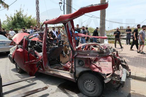 epa12952896 Lebanese rescuers and army soldiers inspect the wreckage of a vehicle that was hit in an Israeli strike in the southern coastal city of Sidon, Lebanon, 13 May 2026.  EPA/WAEL HAMZEH