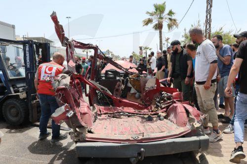 epa12952898 Lebanese rescuers and army soldiers inspect the wreckage of a vehicle that was hit in an Israeli strike in the southern coastal city of Sidon, Lebanon, 13 May 2026.  EPA/WAEL HAMZEH